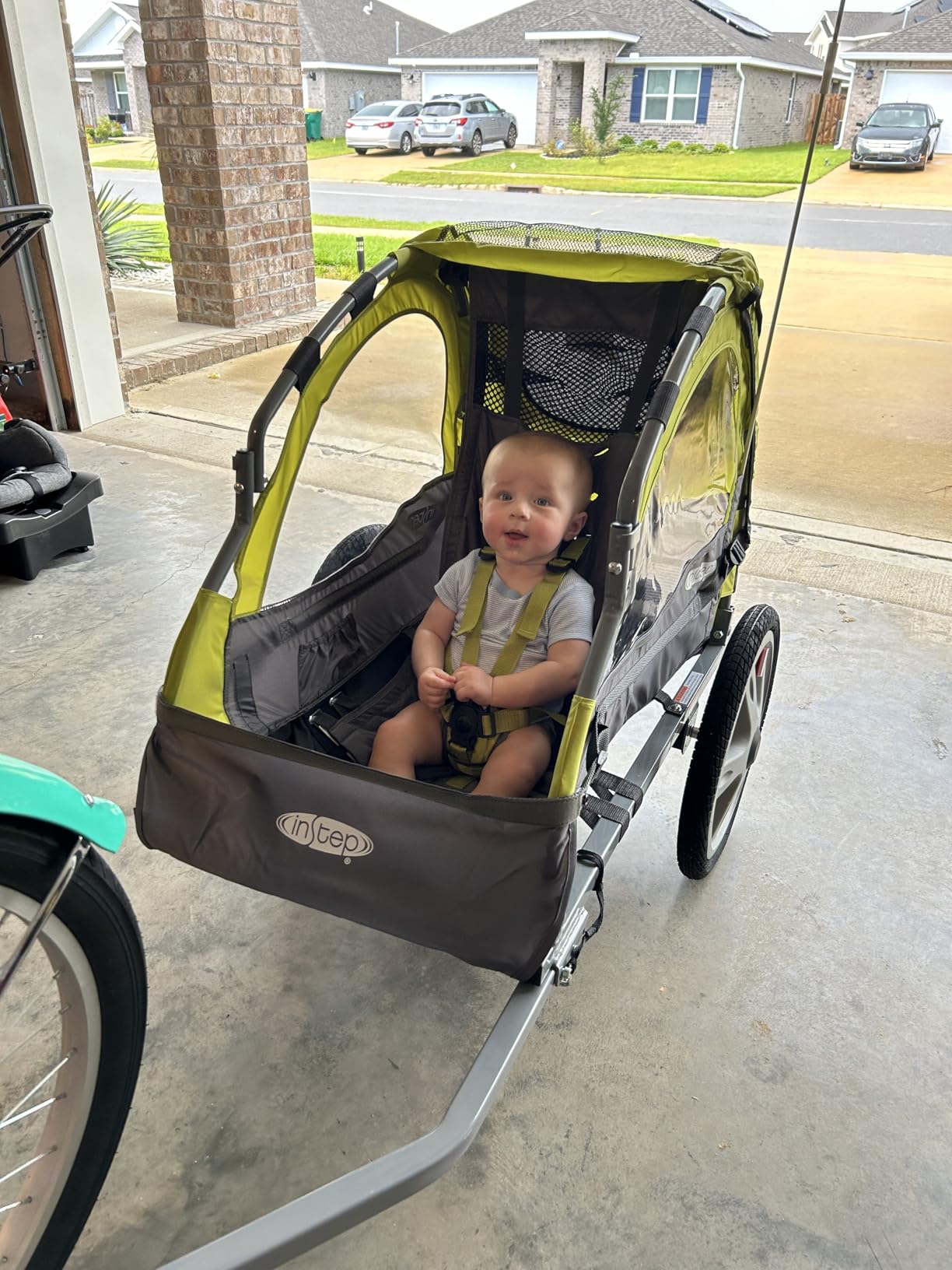 Instep Sync Single Seat Bike Child Trailer, Max Weight 40 lbs., 5-Point Harness, Folding Frame, Quick Release Wheels, Easy Storage, Bug Screen & Weather Shield, Green/Grey customer photo 2