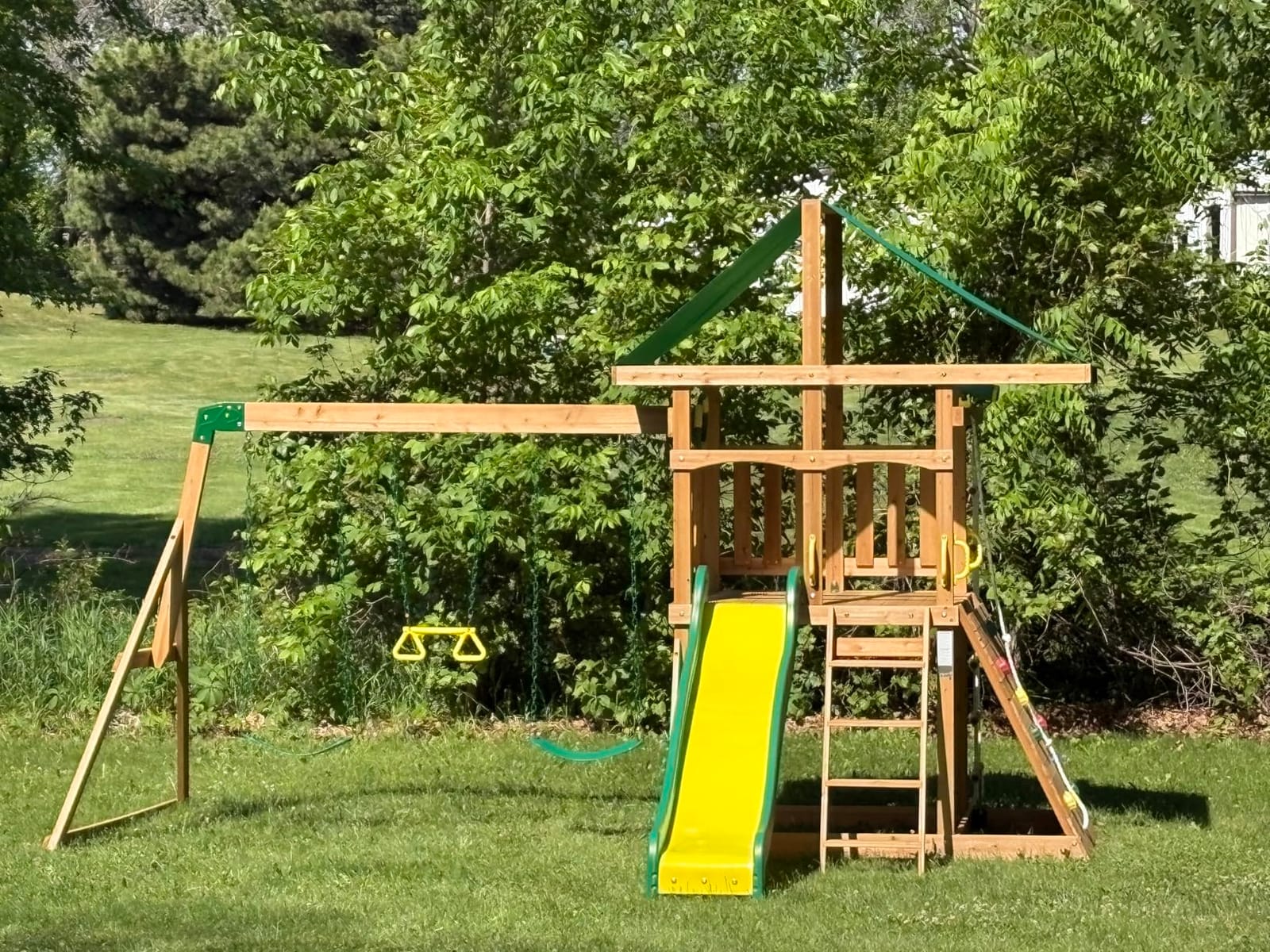 Backyard Discovery Mount Mckinley Cedar Wood Swing Set with Wave Slide, Play Deck, Double Rock Wall, Rope Ladder, Web Swing, Belt Swings, Toy Telescope, Steering Wheel, Sandbox Area, Outdoor Playset customer photo 1