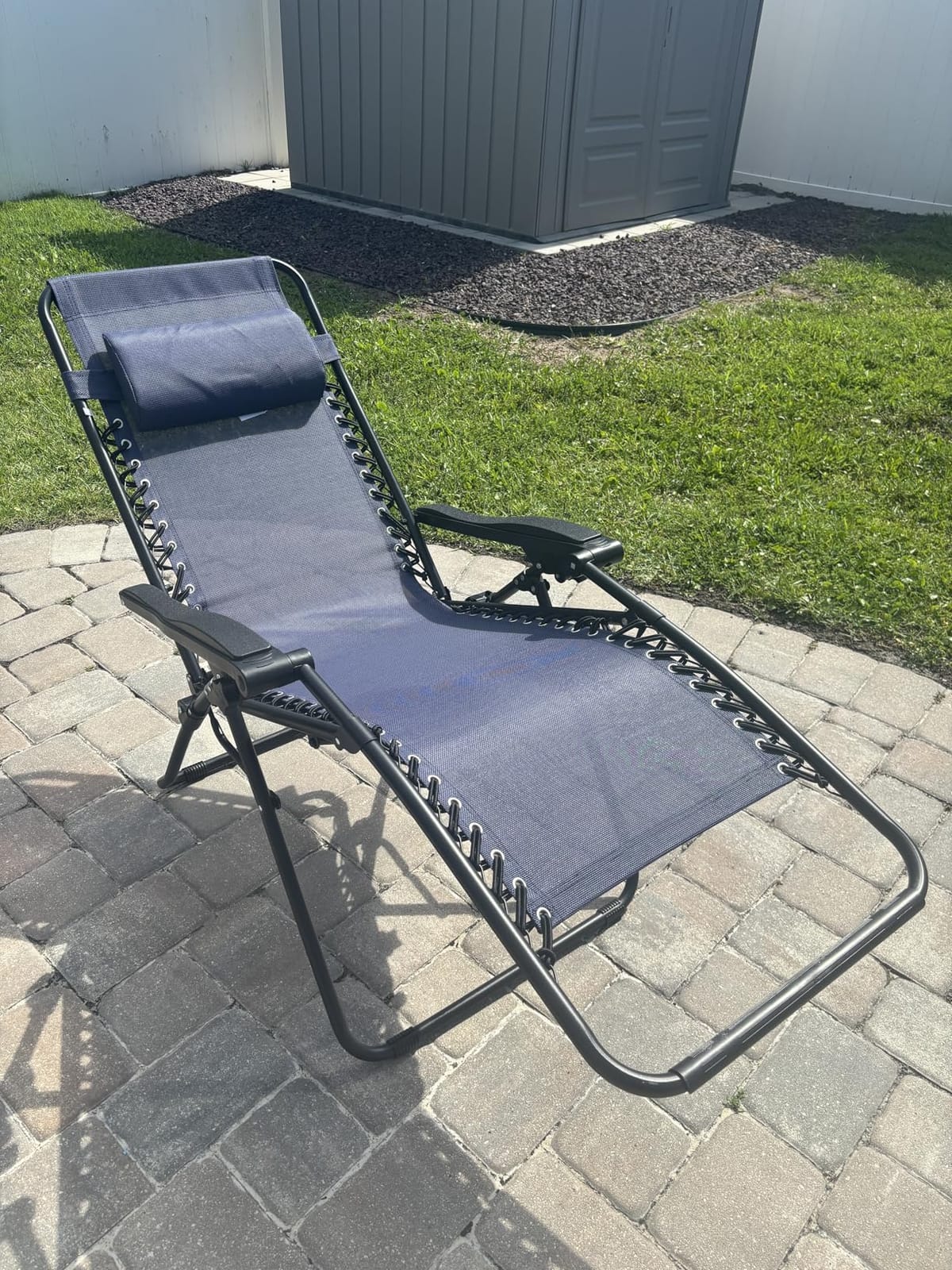 Amazon Basics Zero Gravity Lounge Chair with Pillow, Foldable Outdoor Reclining Chair for Patio and Beach, Weather-Resistant Textilene, 300 lb Capacity, 26 Inch, Black customer photo 2