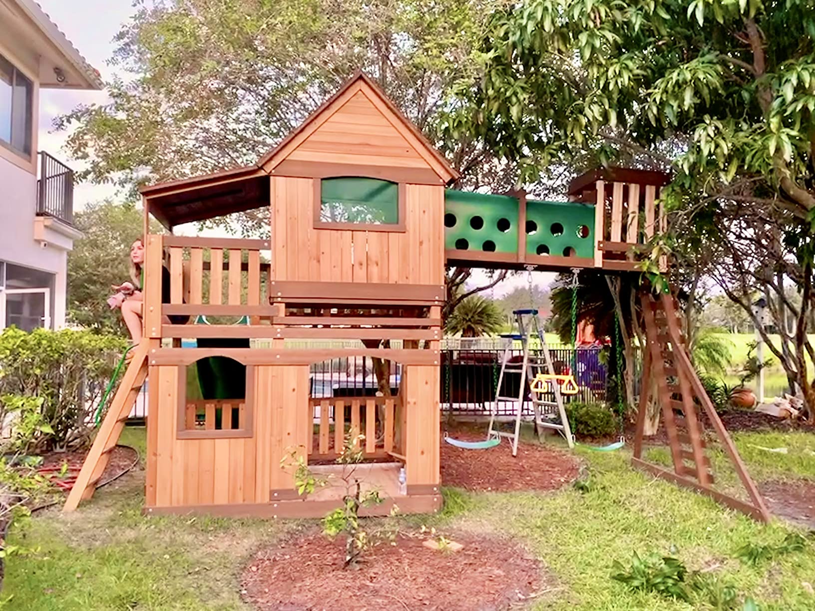 Backyard Discovery Woodridge Elite Cedar Wood Swing Set with Wave Slide, Clubhouse, Crawl Tunnel, Crow's Nest, Belt Swings, Trapeze, Rock Wall Ladder, Sandbox, Wrap-Around Porch, Deck, Outdoor Playset customer photo 1