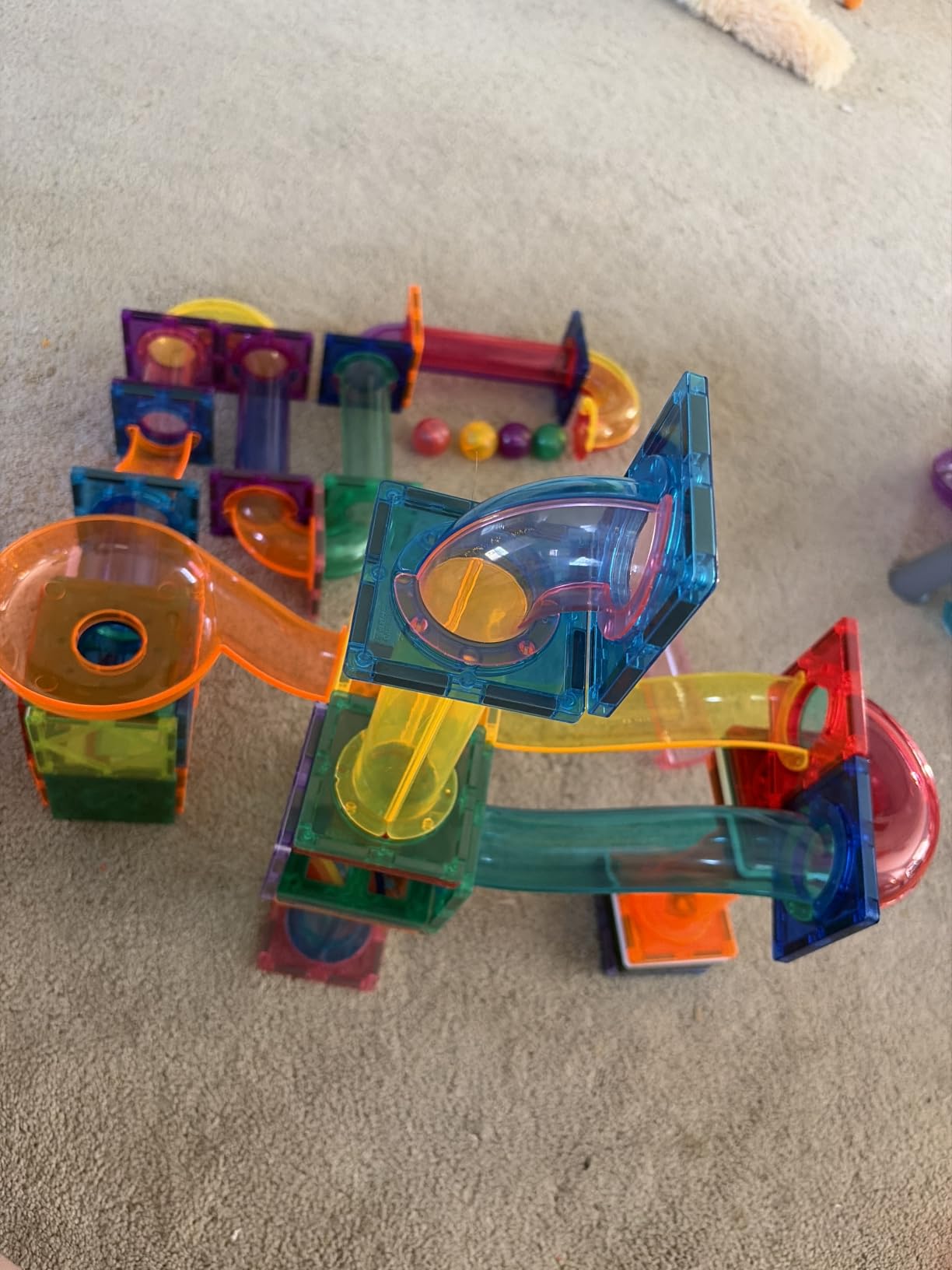 PicassoTiles 100 Piece Marble Run Magnetic Tiles Race Track STEM Ages 3+ | BPA-free ABS plastic, reinforced edges, curved slopes and U-turns, steel balls included, open-ended maze layouts, shared play customer photo 1