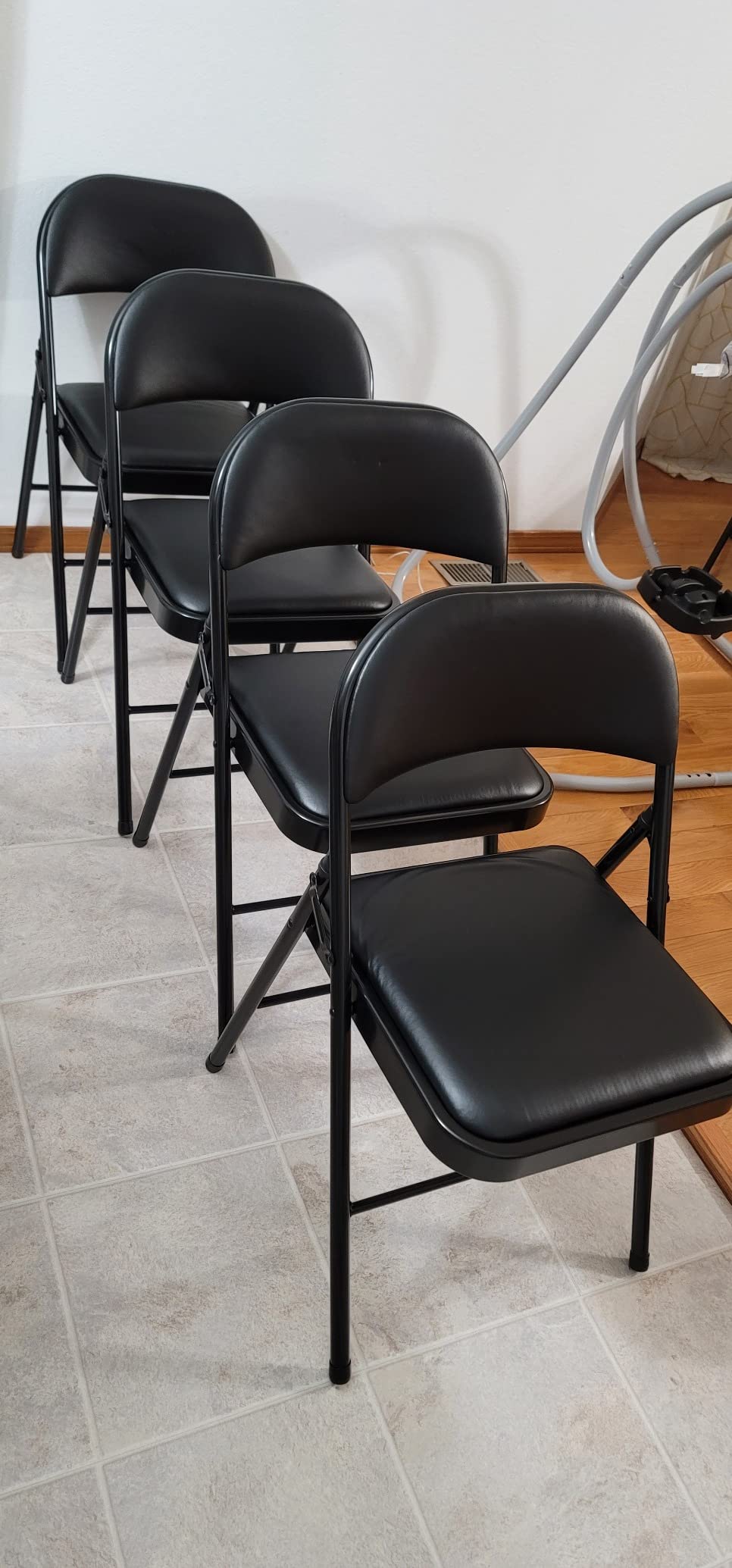 Amazon Basics Comfortable Vinyl-Padded Metal Steel Folding Chairs for Events, Easy to Fold and Store, Black, 4-Pack customer photo 2