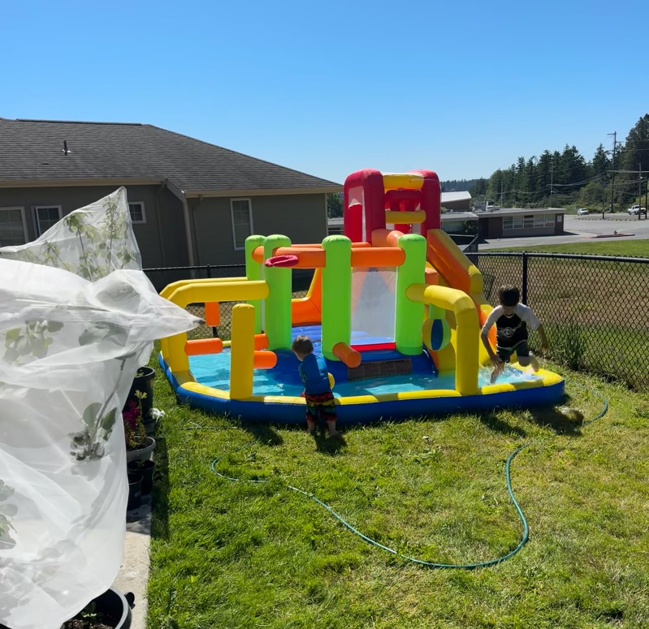 Umbalir 9-in-1 Inflatable Obstacle Bounce House with Water Slide - Kids Bounce House Water Park with Surprise Dump Bucket, Jumping, Tunnels, Climbing Wall, Water Cannon, and Ball Shooting Frame customer photo 1