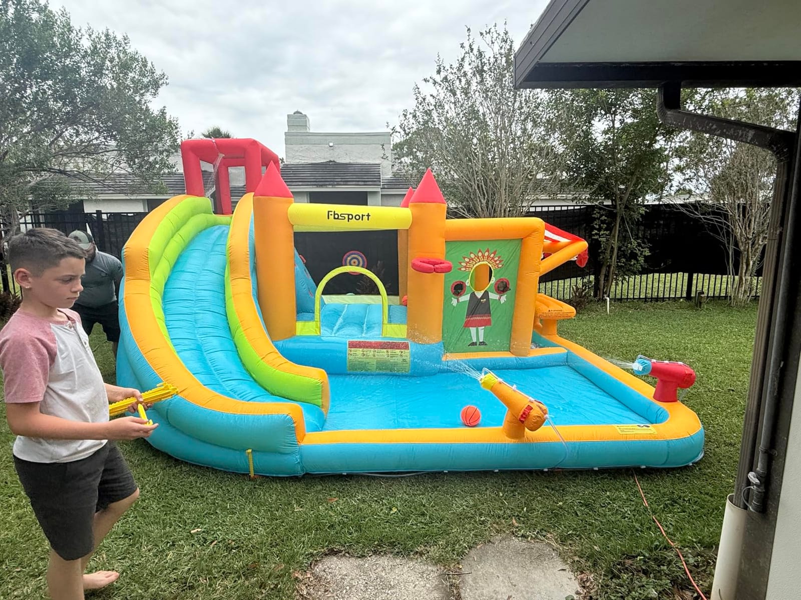 FBSPORT Inflatable Bounce House Water Slide, Bounce House for Kids with Toy Market Stand Splash Pool Bouncer Climbing Wall Water Gun Ball Dart, Bouncy Castle W/620W Blower for Outdoor Indoor, Red customer photo 1