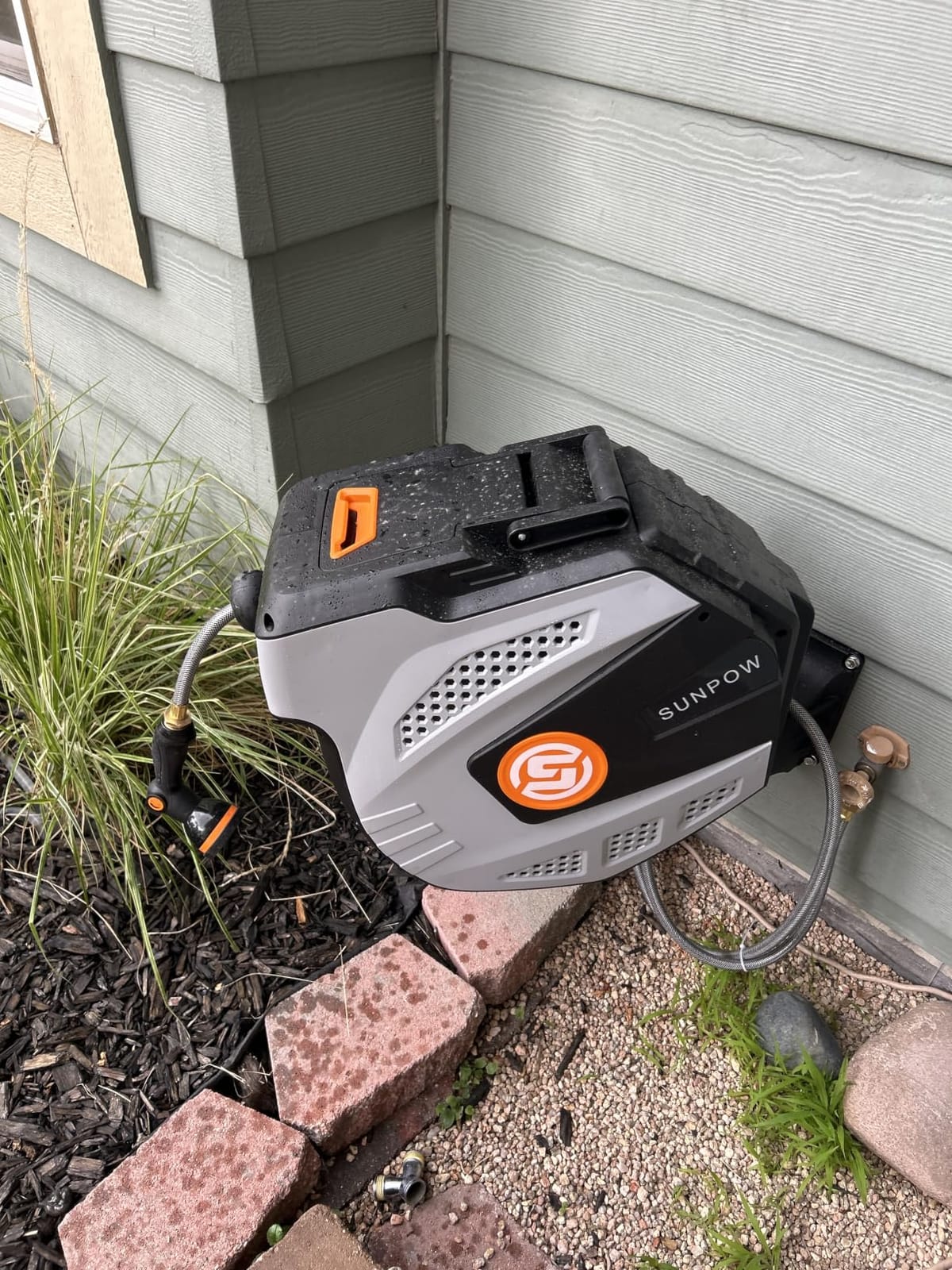 SUNPOW Retractable Garden Hose Reel - 1/2 inch x 50ft Heavy Duty Wall Mounted Hose Reel with 3/4 inch Brass Fitting & 10 Sprayer Nozzle - Any Length Lock, Auto Rewind System, 180° Swivel Bracket - Grey customer photo 1