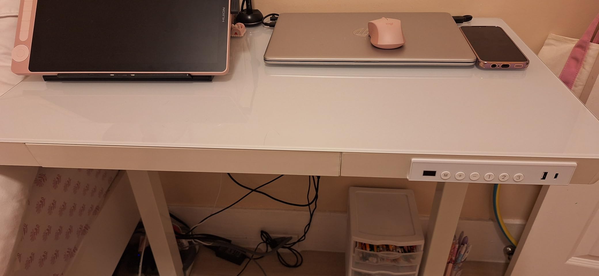 HUANUO Glass Standing Desk with Drawers, 48 X 24 Inch Electric Adjustable Height Desk, Quick Install One-Piece Tabletop with USB Charging Ports, White customer photo 2