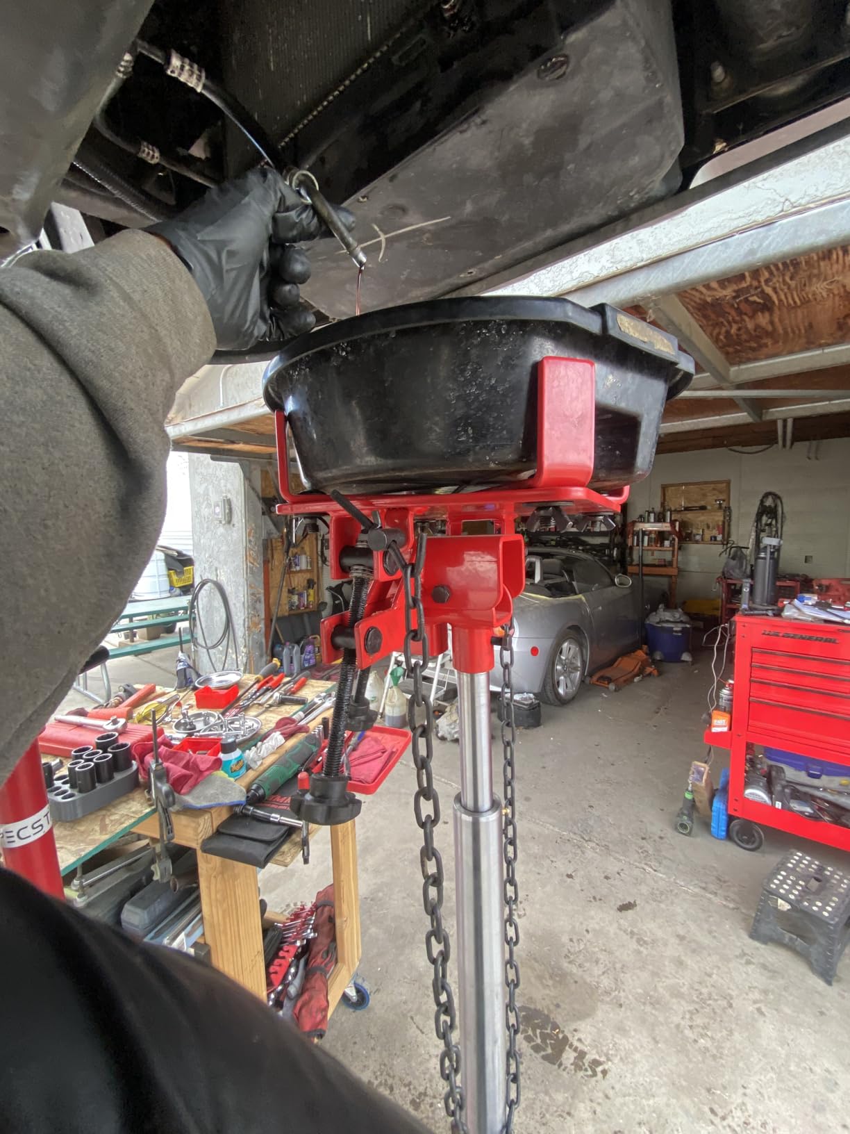 Sunex Tools 7793B 1,000 lb Telescopic Transmission Jack, Hydraulic, Foot Pump Operated, Tilt Saddle with Chain Tie-Down, 74.2 in Max Height customer photo 1