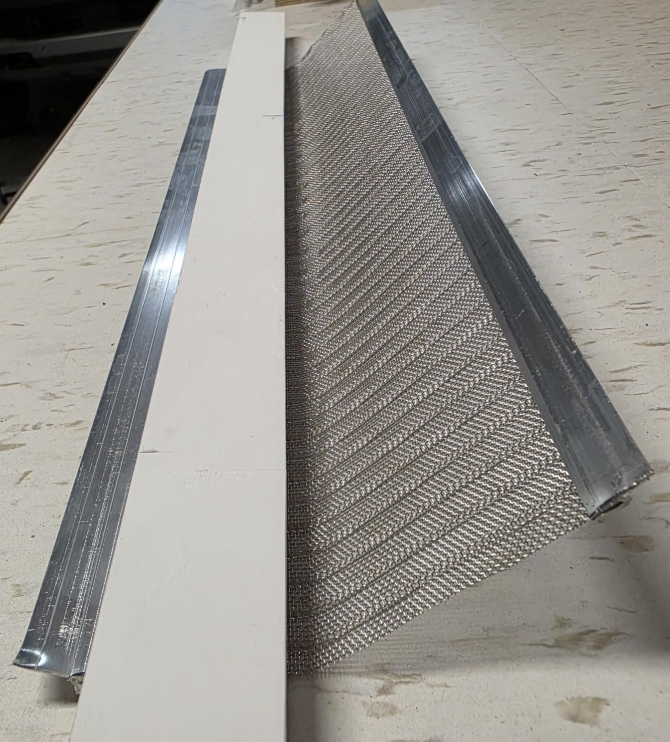 RAPTOR GUTTER GUARD – 48 FT. (Nominal) Contractor Grade Stainless Steel Micro-Mesh Gutter Guard Kit with Screws Included. Fits 5 in. Gutters and Smaller. DIY-Friendly. (5.625 in. x 47.625 in.) customer photo 1